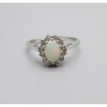 An 18ct gold, opal and diamond ring, 3.4g, P