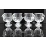 Four French glass moulded eggcups in the shape of chickens