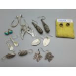 Nine pairs of silver earrings