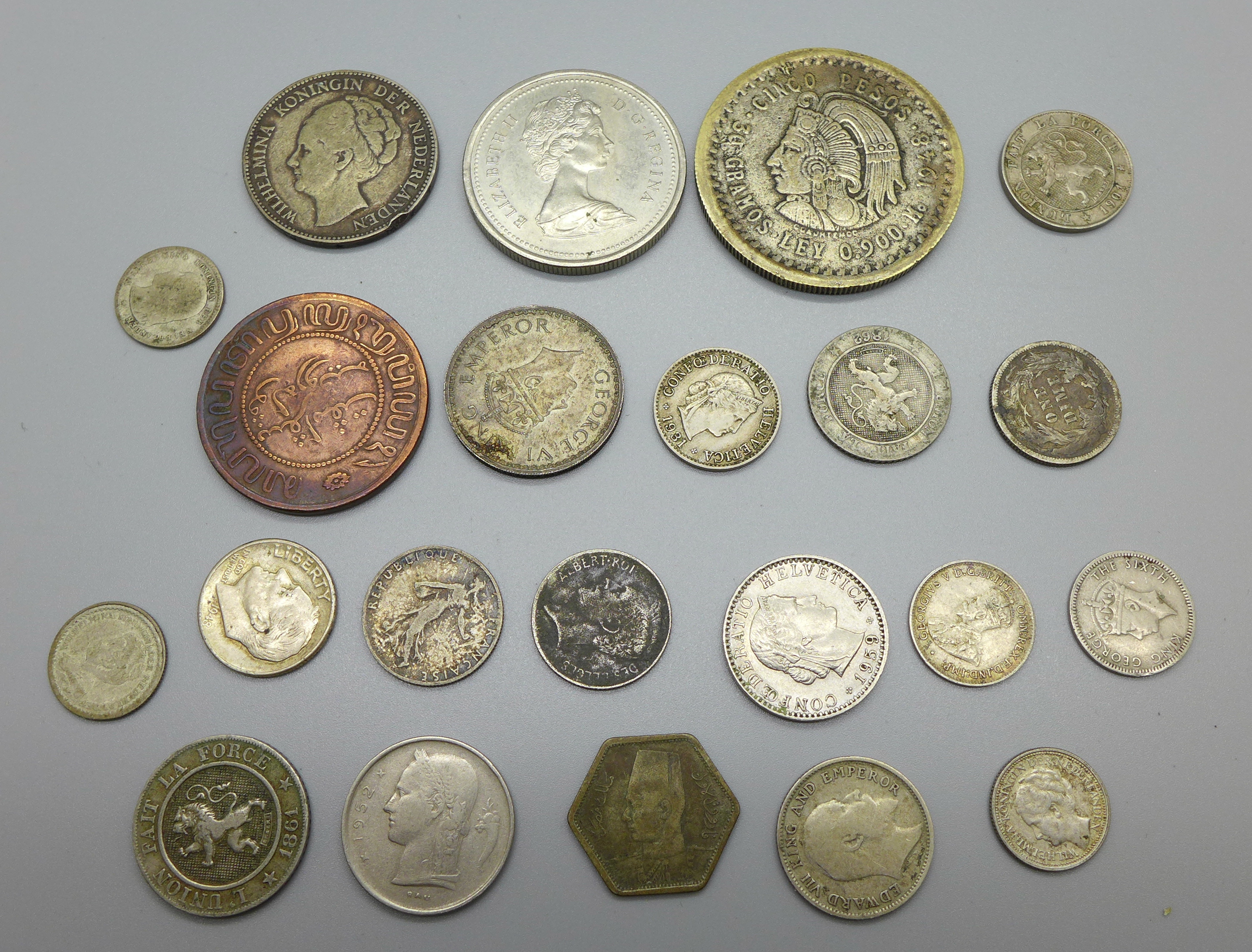 Foreign coins including some silver, (one reproduction Mexican coin)