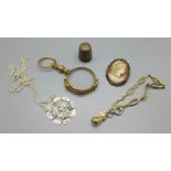 A pair of plated lorgnettes, jewellery and a thimble