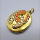 A c1900 locket set with seed pearls and coral, tests as 15ct gold, some blue enamel a/f, 17.3g,