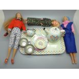 Two Barbie dolls and one other doll and a doll's tin plate tea set