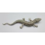 A silver and marcasite lizard brooch