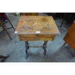 A Victorian burr walnut sewing table on associated beech base