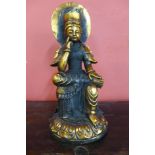 A gilt bronze seated bronze deity