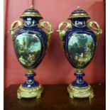 A pair of large Sevres style continental lidded vases
