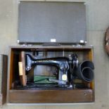 A vintage cased Singer sewing machine