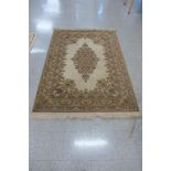 A beige ground rug, 200 x 141cms
