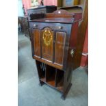 An Edward VII inlaid mahogany music cabinet