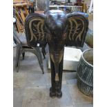 A carved wooden figure of an elephant