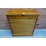 An early 20th Century oak tambour front filing cabinet