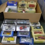 A collection of Corgi, Solido, Lledo, and other die-cast model vehicles, boxed