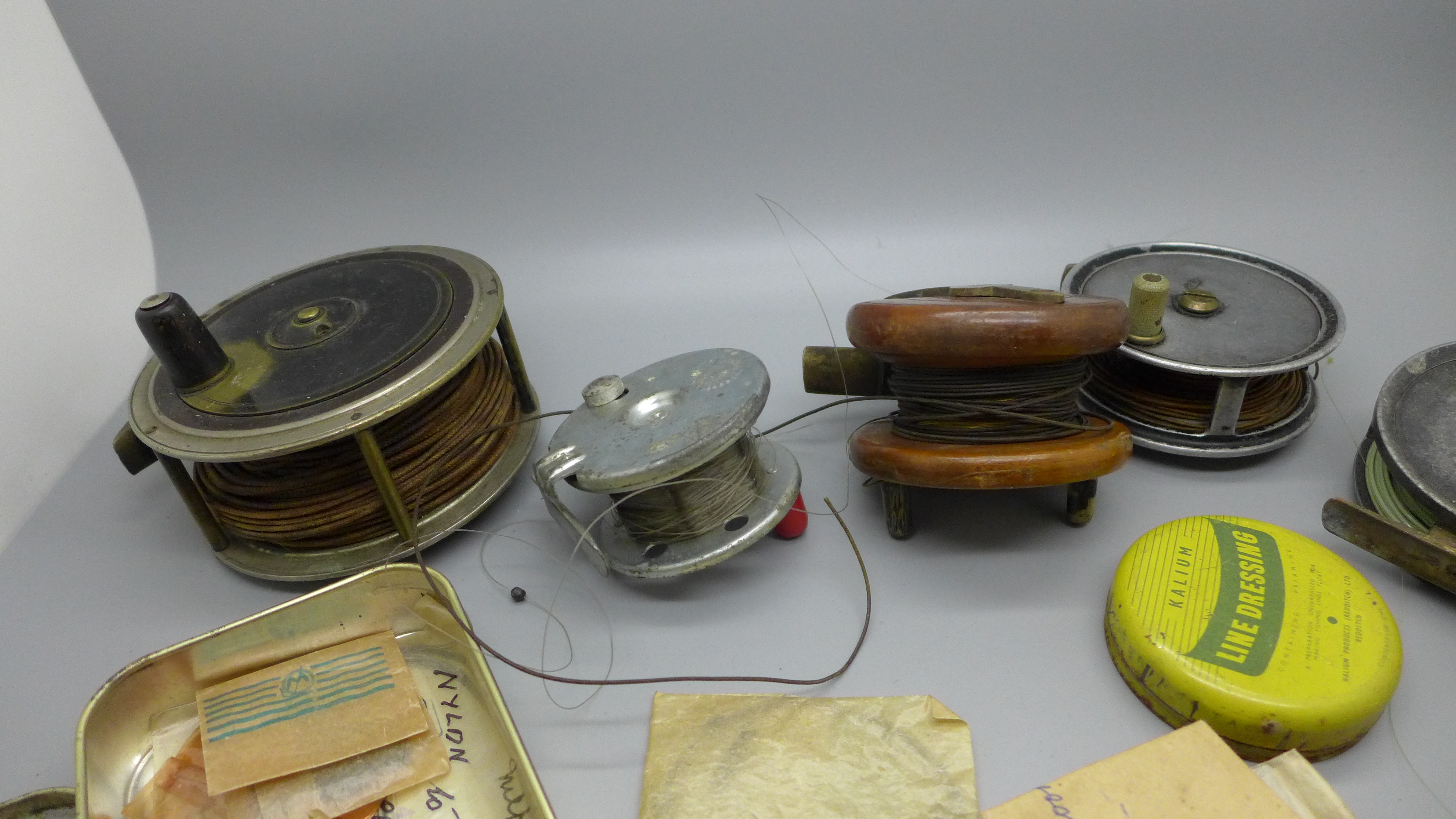 A collection of fishing reels including V. Peek & Son, London and Gamage, London, and a collection - Image 2 of 4