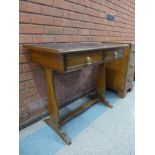 A Victorian ash two drawer writing table