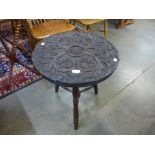 A late Victorian carved oak circular occasional table