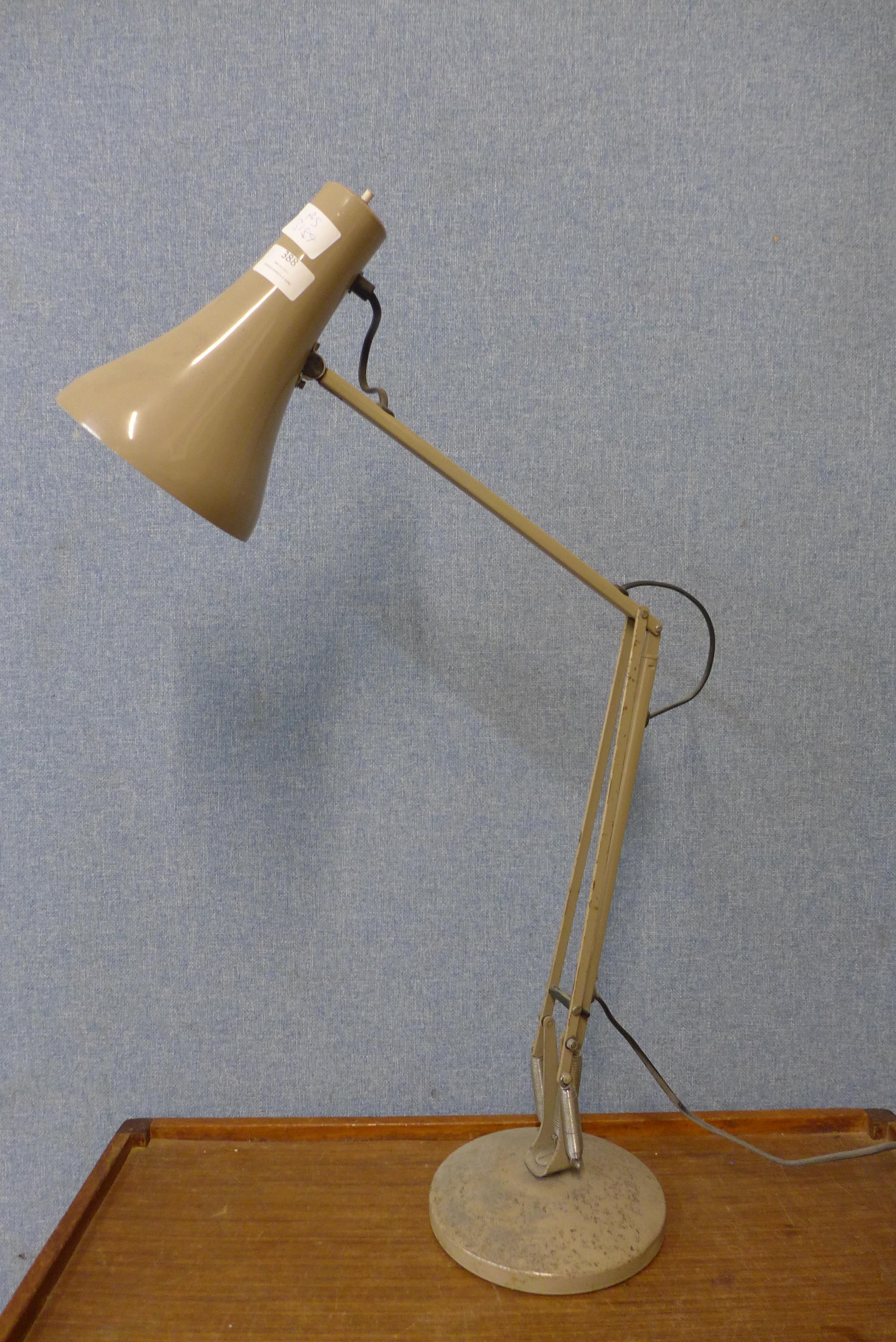 A grey metal anglepoise desk lamp