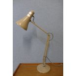 A grey metal anglepoise desk lamp