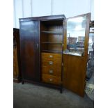 An Art Deco inlaid mahogany fitted compactum style wardrobe