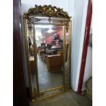 A large gilt French style gilt framed mirror with crest, 183 x 90cms (M32168) #