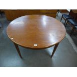 A teak extending dining table