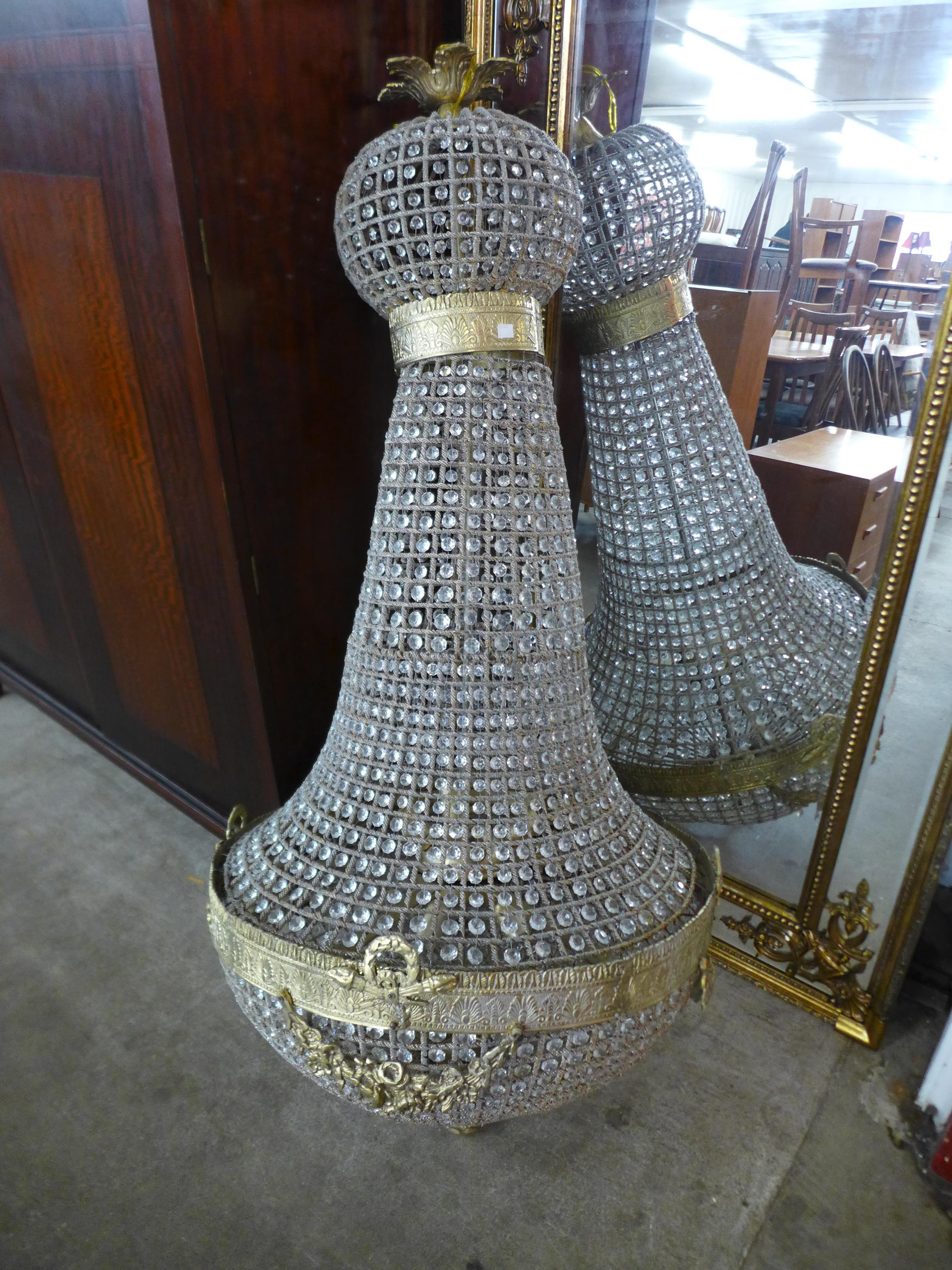 A large French Empire style gilt metal and glass bag shaped chandelier