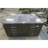 A steel table top index drawer cabinet