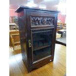 An Edward VII carved beech side cabinet