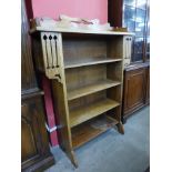 An Arts and Crafts oak open bookcase