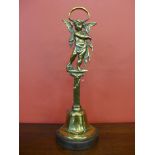 A Victorian brass cast iron based door porter, depicting Cupid