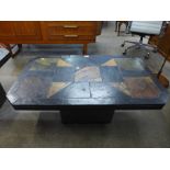 A South African Brutalist slate topped coffee table, in the style of Paul Kingma