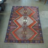 A Persian hand knotted wool red ground Ghoochan rug, 165 x 122cms