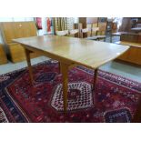 A teak extending dining table