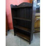 A small Arts and Crafts oak open bookcase