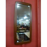 A teak framed mirror