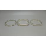 Three silver bangles, 80g