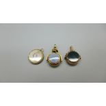 A hallmarked 9ct gold swivel fob, Birmingham 1910, one other swivel fob and a 9ct gold late