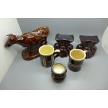 A majolica model of a cow, a/f, a pair of Victorian studio pottery salts, two mugs, a/f and two