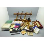 A collection of pipes, four Cuban cigars, pipe rack, an Accurist wristwatch, etc.