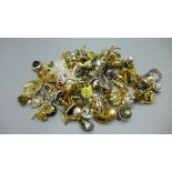 Twenty-eight pairs of clip-on earrings, cufflinks, tie-pins, rings, etc.