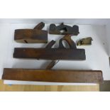 Five woodworking planes, including one small brass example