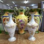 Two large two handled vases, a pair of smaller vases and one other vase