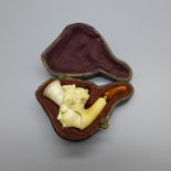 A carved pipe, cased, amber mouthpiece a/f