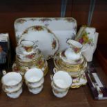 A collection of Royal Albert Old Country Roses tea ware, table cloth and knife