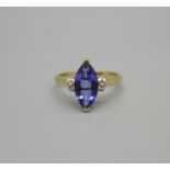 A 14k gold ring set with a 0.81ct marquise tanzanite and eight diamonds, 2.6g, N
