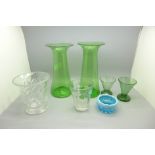 A pair of green glass vases, a glass beaker with etched WWI reference, a blue glass salt, a cut