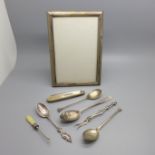 A silver and mother of pearl penknife, three silver spoons, one other spoon, a silver photograph