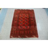 An eastern red ground rug, 145 x 105cms