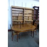 A G-Plan Fresco teak extending dining table and four chairs