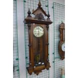 A 19th Century walnut Vienna double weight wall clock